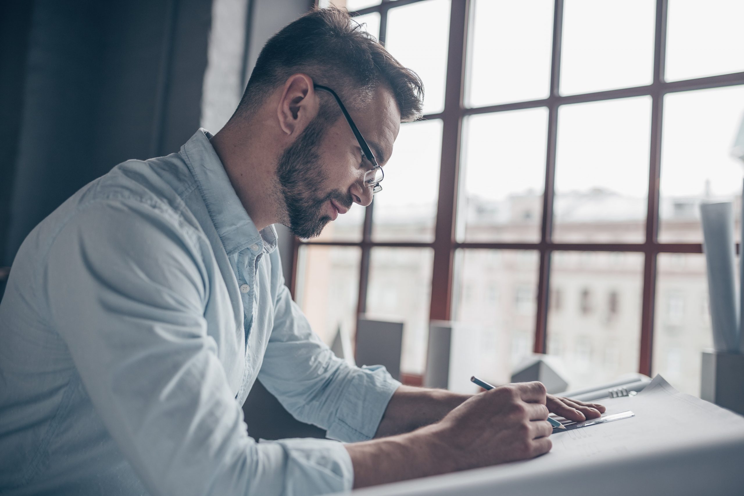 writing man at work NP4EF6Z min scaled 1