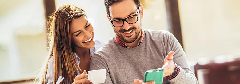 Beautiful loving couple sitting in a cafe enjoying in coffee and conversation.jpg.thumb .276.780